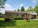 Beautifully landscaped front yard with lush green grass and charming curb appeal at 26858 State Road 19, Arcadia, IN 46030