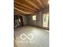 Unfinished basement offers a blank canvas for creating your dream space, featuring natural light at 5826 Petersburg Pkwy, Indianapolis, IN 46254