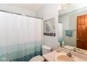 Bathroom with decorative curtain, single sink and large mirror at 662 Leah Way, Greenwood, IN 46142