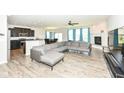 Open-concept living area with fireplace, kitchen, and dining, perfect for entertaining at 8864 Rowling Way, Indianapolis, IN 46239