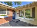 Charming front entrance with a black door and flower boxes at 911 Glendale Dr, Lebanon, IN 46052