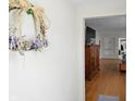 Inviting living room with hardwood floors and a glimpse into other rooms, enhancing the home's appeal at 95 S 11Th Ave, Beech Grove, IN 46107