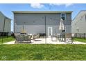 Spacious outdoor patio with comfortable seating and string lights, perfect for entertaining at 9855 Oakmont E E Dr, Pendleton, IN 46064