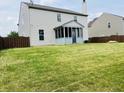 Large backyard featuring a screen porch and tall, wooden fence at 9987 Rainbow Falls Ln, Fishers, IN 46037