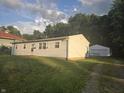 A well-kept house with a detached garage and beautiful surroundings at 1201 E Gimber St, Indianapolis, IN 46203