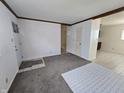 Spacious living room featuring fresh paint and a glimpse into the kitchen at 1201 E Gimber St, Indianapolis, IN 46203