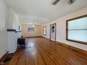 Spacious living room with hardwood floors and a brick fireplace at 1602 California St, Columbus, IN 47201