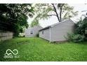 Backyard with a green lawn that has some trees at 2305 Barnor Dr, Indianapolis, IN 46219