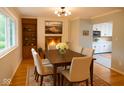 Traditional dining room featuring a wood table, four chairs, and a fireplace at 2922 E 62Nd St, Indianapolis, IN 46220