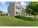 Well-maintained home with lush green lawn and tidy landscaping at 3230 Hemlock St, Whiteland, IN 46184