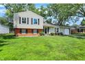 Charming two-story home featuring a well-manicured lawn, classic design, and a cozy, inviting appeal at 3663 Kline N Dr, Indianapolis, IN 46226