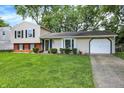 Charming two-story home featuring a well-manicured lawn, classic design, and a cozy, inviting appeal at 3663 Kline N Dr, Indianapolis, IN 46226