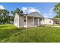 Inviting single-story home with a covered front porch and fresh landscaping at 4749 W Smith Valley Rd, Greenwood, IN 46142