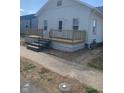 Charming home boasts a freshly updated exterior and cozy, inviting front porch at 803 S Pershing Dr, Muncie, IN 47302