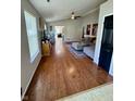 Hardwood floors accent this living room with vaulted ceilings, neutral walls, and natural light at 8323 Lake Tree Ln, Indianapolis, IN 46217