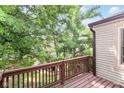 View from the deck showcases lush greenery, providing a serene and private outdoor living space at 9552 Maple Way, Indianapolis, IN 46268
