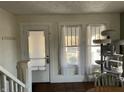 Bright entryway with windows, staircase, and space for a cat tree or other decor at 118 S Swain St, Ingalls, IN 46048