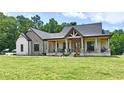 Charming two-story home with a covered porch and beautiful stone and brick accents at 1284 N Letterman Rd, Paragon, IN 46166