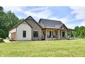 Charming two-story home with a covered porch and beautiful stone and brick accents at 1284 N Letterman Rd, Paragon, IN 46166