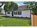A well-maintained home with a manicured lawn and simple, pleasing landscaping details at 1648 Ringgold Ave, Indianapolis, IN 46203