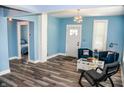 Bright living room showcasing modern décor, a cozy seating arrangement, and light hardwood floors at 206 Olive St, Arcadia, IN 46030