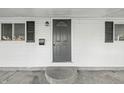 Close-up of the front door featuring classic design elements and secure entry at 212 N 13Th St, Elwood, IN 46036
