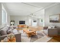 Bright living room featuring neutral decor, hardwood floors, and a cozy seating area at 212 N 13Th St, Elwood, IN 46036