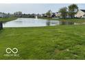 Green space and scenic water feature with fountain creating a peaceful environment at 2230 Cedarmill Dr, Franklin, IN 46131