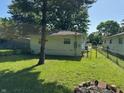 Lush backyard featuring a well-maintained lawn, perfect for outdoor activities and relaxation at 2354 Collier St, Indianapolis, IN 46241