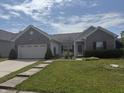 Charming single Gathering home with attached two car garage and a well maintained lawn at 2929 Tuscarora Ln, Indianapolis, IN 46217