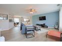 Bright and airy living room featuring modern furnishings, hardwood floors, and a ceiling fan at 3350 Cessna Dr, Columbus, IN 47203