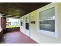 Covered porch with brick columns, white trim, and a cozy, welcoming feel at 3609 N Keystone Ave, Indianapolis, IN 46218