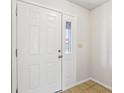 A classic white paneled front door with a side window welcomes you into the home at 373 Austin Dr, Avon, IN 46123