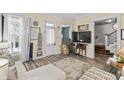 Bright living room with large windows, stylish decor, and an open layout, perfect for modern living and gatherings at 38 W Main St, Brownsburg, IN 46112