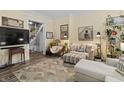 Cozy living room featuring hardwood floors, soft lighting, and comfortable seating, ideal for relaxing and entertaining at 38 W Main St, Brownsburg, IN 46112