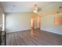 Open-concept living room with vaulted ceiling, fireplace and new flooring at 6029 Sycamore Forge Dr, Indianapolis, IN 46254