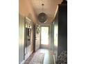 Bright entryway featuring hardwood floors, decorative lighting, and neutral walls at 8425 Brook Pointe Ct, Indianapolis, IN 46234