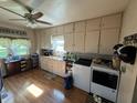 A view of the kitchen with ample storage cabinets and modern washing machine at 9721 S 100 E, Pendleton, IN 46064