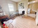 Bright dining area with hardwood floors, modern table and chairs, view to the kitchen at 1002 S Fleming St, Indianapolis, IN 46241