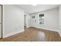 Living room showcasing hardwood floors, white walls, and natural light at 1151 S Randolph St, Indianapolis, IN 46203