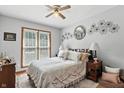 Cozy bedroom with a queen bed, decorative accents, and abundant natural light at 1346 N Buck Creek Rd, Greenfield, IN 46140