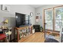 Comfortable living room features a TV, decorative elements, and a window with blinds at 1346 N Buck Creek Rd, Greenfield, IN 46140