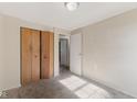 Carpeted bedroom with bright natural light and closet at 1809 Mutz Dr, Indianapolis, IN 46229