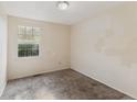 Carpeted bedroom with bright natural light and neutral walls at 1809 Mutz Dr, Indianapolis, IN 46229