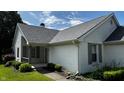 Charming house with a covered porch and well-manicured landscaping, offering a cozy and inviting entry at 2083 Kerns Ct, Carmel, IN 46280