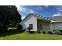 This home showcases a lovely covered porch and beautiful landscaping, perfect for outdoor relaxation and enjoyment at 2083 Kerns Ct, Carmel, IN 46280