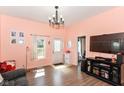 Bright living room featuring hardwood floors, natural light, and a welcoming entrance, perfect for entertaining at 2702 S Moreland Ave, Indianapolis, IN 46241