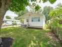 Cozy single-story home with nice landscaping, a fenced yard and freshly painted exterior at 2909 S Randolph St, Indianapolis, IN 46203