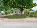 Lovely single-story home with mature shade tree, fenced yard, and well-kept lawn at 2909 S Randolph St, Indianapolis, IN 46203