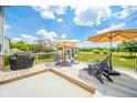 Relaxing back deck featuring patio furniture, grill, and a partially covered area, perfect for outdoor entertaining at 296 Myers Lake Dr, Noblesville, IN 46062